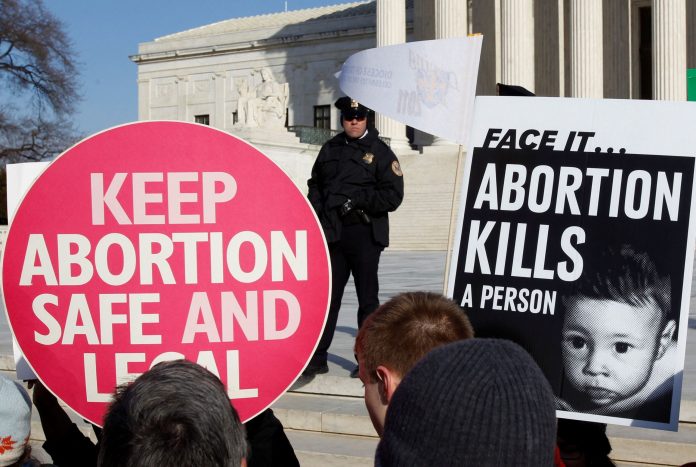 2022-05-03t212335z-1474582896-rc2wzt9j9cie-rtrmadp-3-usa-abortion-poll-2-scaled